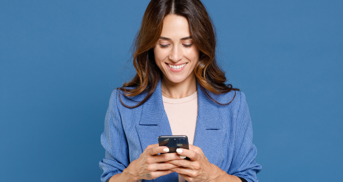 woman holding mobile phone-with smling